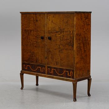 A 1920's-30's Swedish Grace birch and rosewood veneered cabinet.