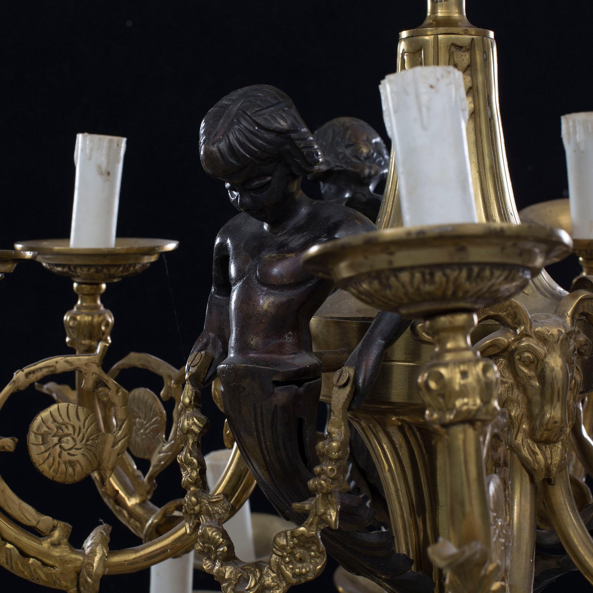 A Louis XVI-style brass chandelier, first half of the 20th Century.