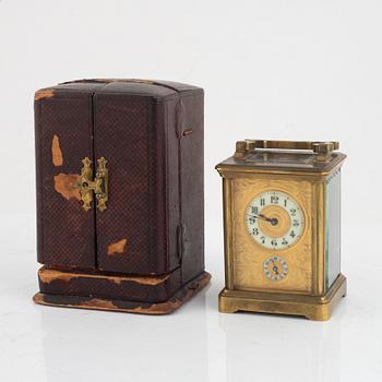 A brass carriage clock, circa 1900.