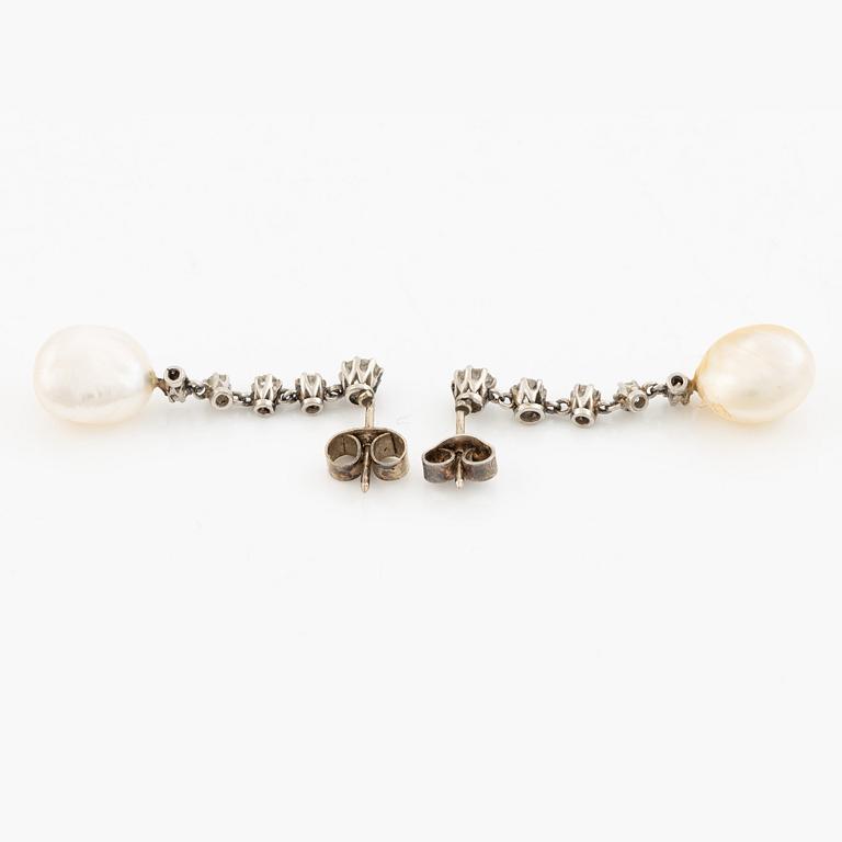 A pair of  earrings in white gold with pearls and old-cut diamonds.