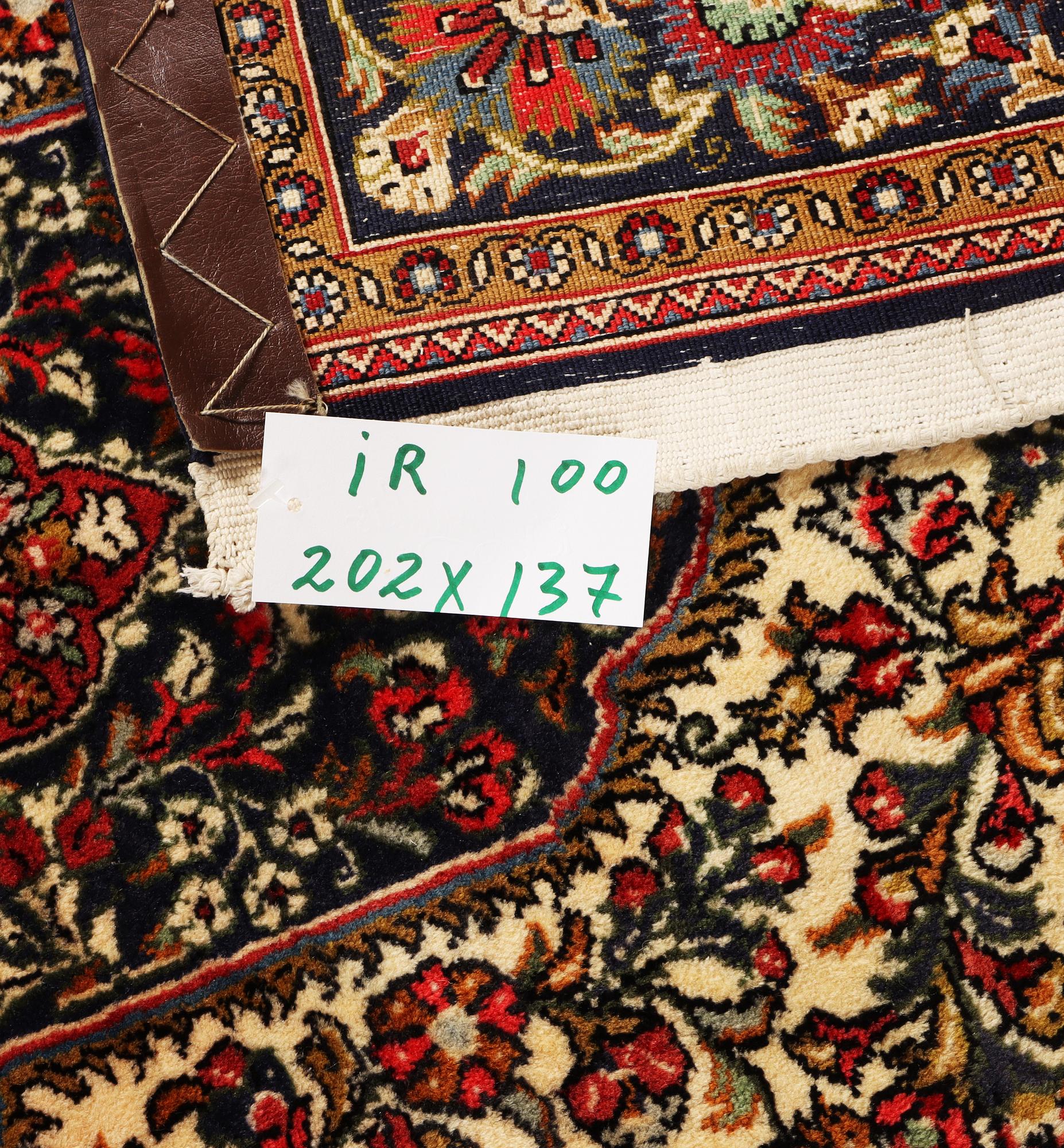 A Ghom rug, c. 202 x 137 cm.