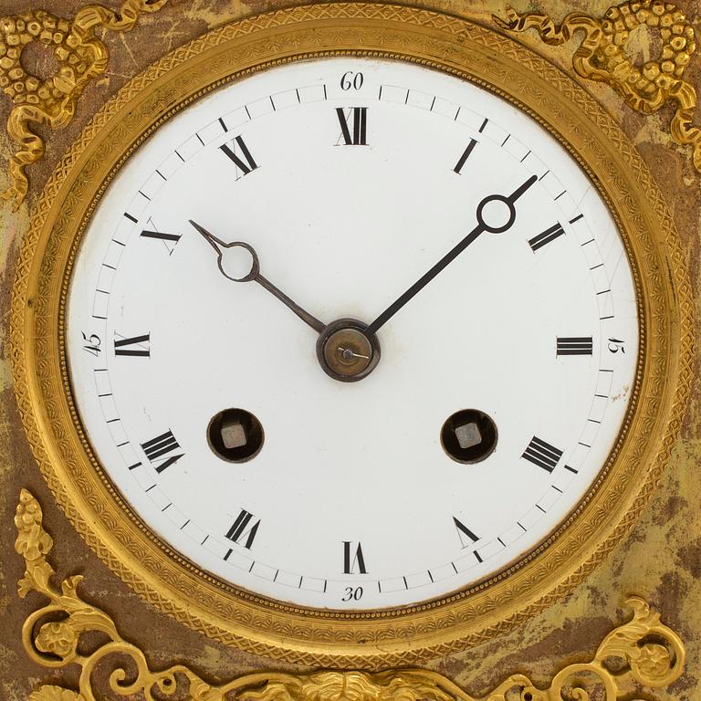 A French Empire gilt bronze mantel clock, first half of the 19th century.
