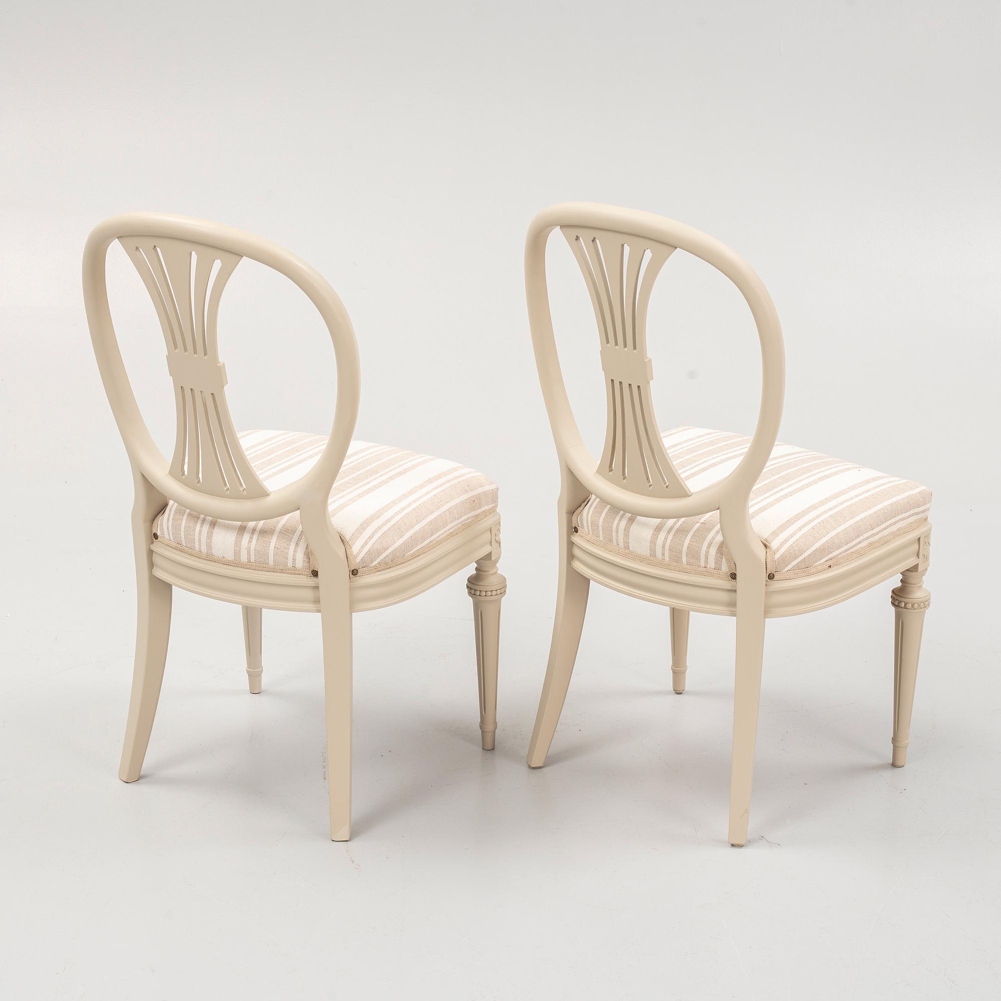 A Gustavian style dining table and eight chairs, late 20th Century.