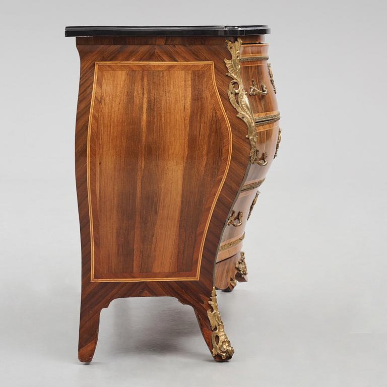 A rococo parquetry and gilt brass-mounted commode possibly by C. Åhman (master in Stockholm 1748-1783).