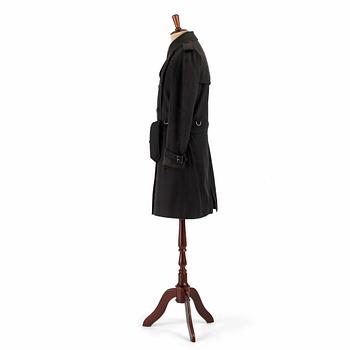 BURBERRY, a black cotton trenchcoat.