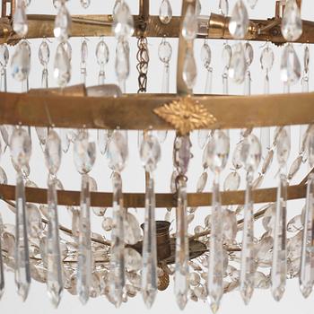 A late Gustavian gilt brass and cut glass seven-light chandelier, Stockholm, late 18th century.