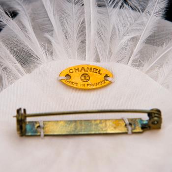 CHANEL, A White Chiffon Colifich Brooch.