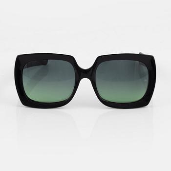 Oliver Goldsmith, a pair of "Fuz" sunglasses.