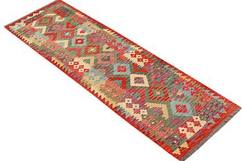 A carpet, Kilim, c. 289 x 78 cm.