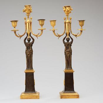 A pair of  Empire early 19th century three-light candelabra.