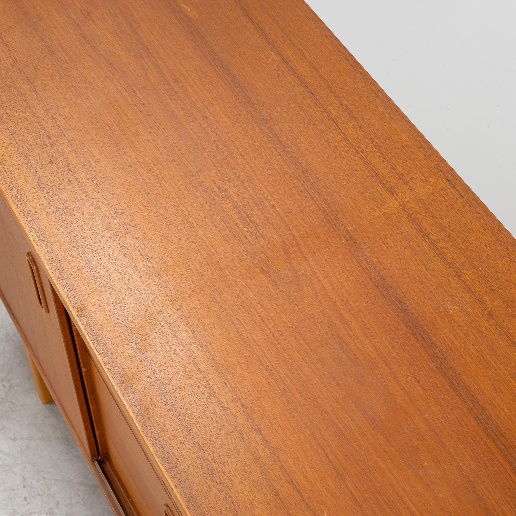 A 1950's/60's teak veneered sideboard.