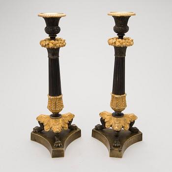 Pair of late empire bronze candlesticks, mid 19th Century.