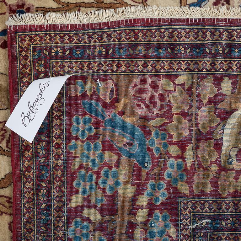 A RUG, a semi-antique Esfahan probably, figural, ca 214,5 x 137,5 cm.