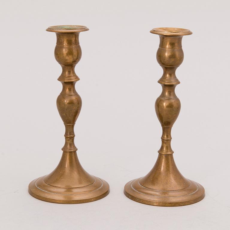 Set of ten 19th/20th Century brass and wood candlesticks.