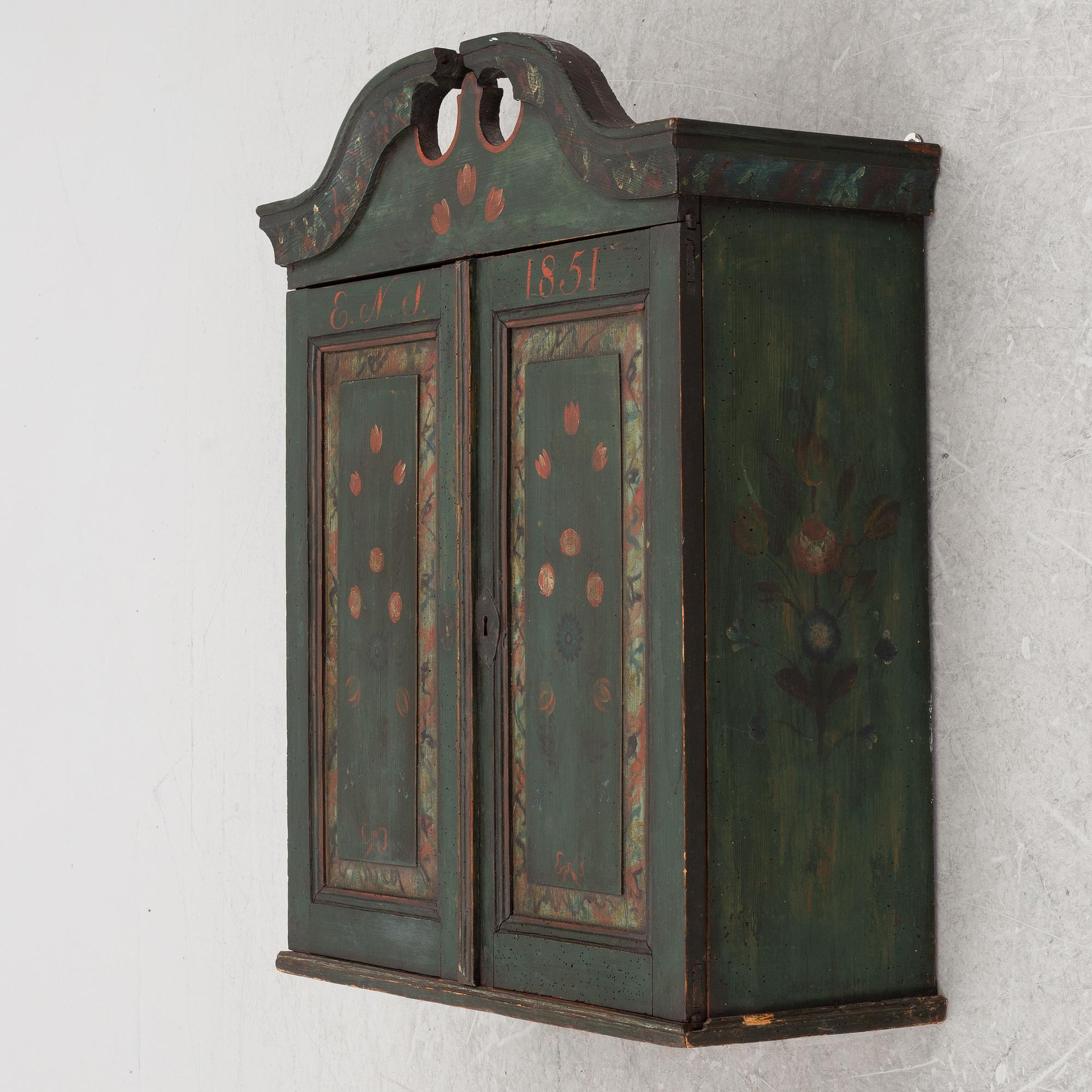 A wall-hanged cabinet, Sweden, dated 1851.