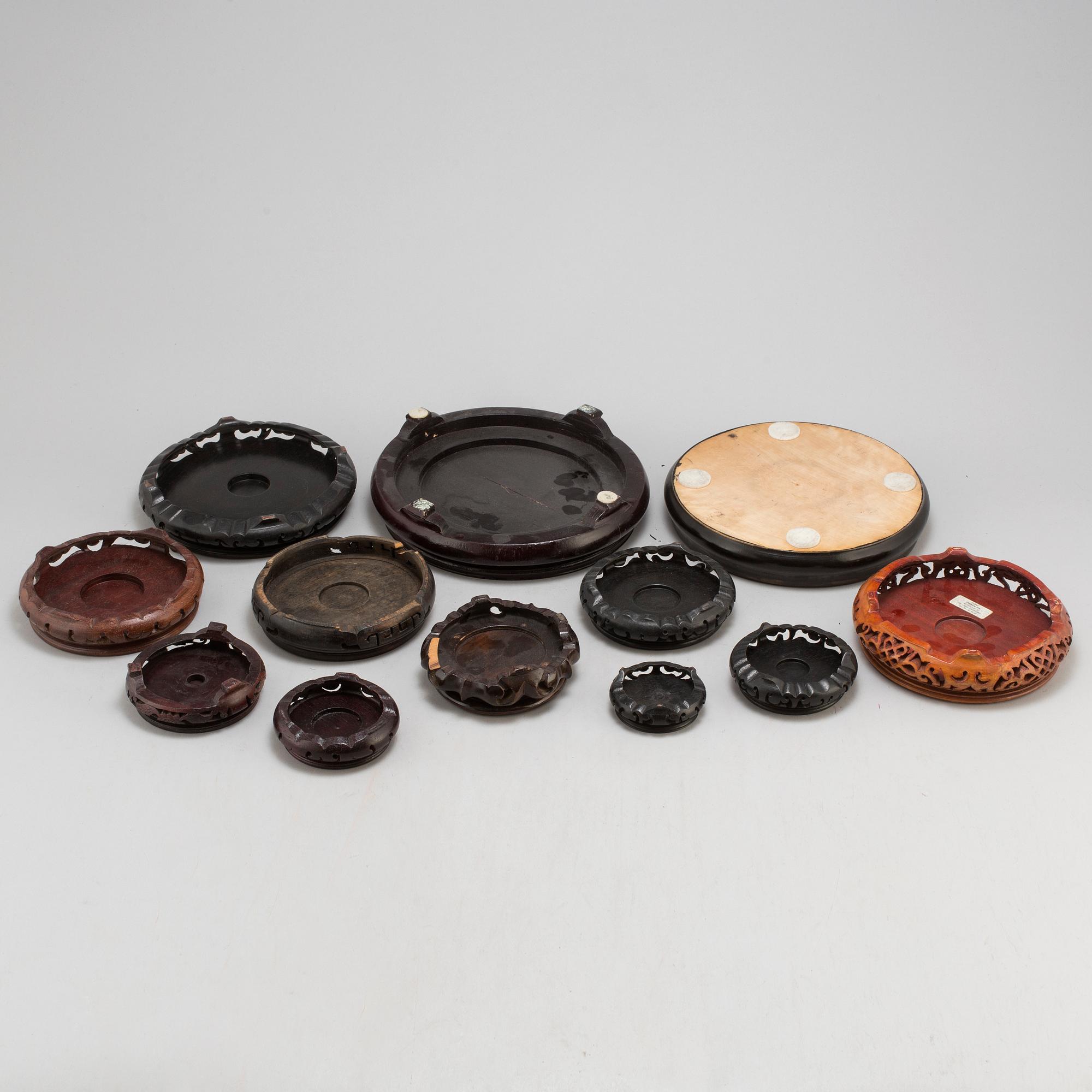 A set of 12 Chinese wooden stands, 19th and 20th Century.