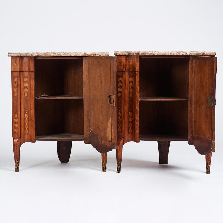 A pair of Louis XVI corner cupboards by Francois Gaspard Teunè (master in Paris from 1766), 18th century.