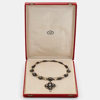 A silver necklace/pendant set with rose-cut diamonds and pearls.