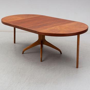 A teak and beech dining table and 6 chairs. Mid 20th century.