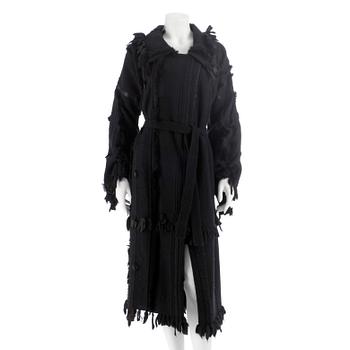 506. GUCCI, a black wool and fur coat. Size 46.