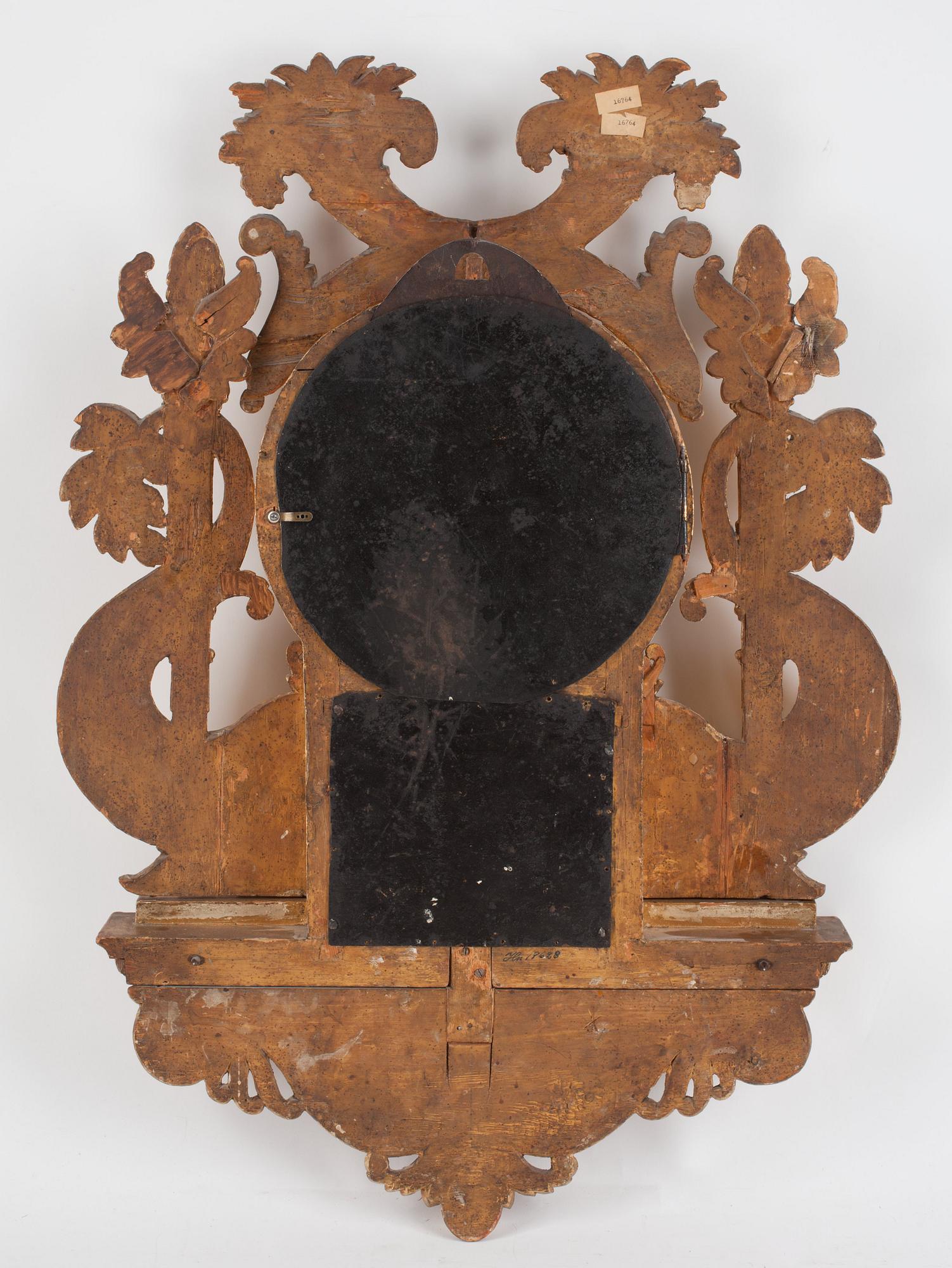 A Swedish Empire early 19th century gilt wood wall clock by I. Dahlström.