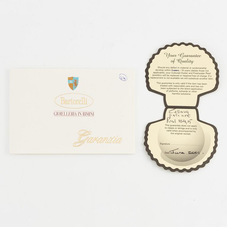 Necklace of cultured freshwater pearls, clasped with 14K white gold and round brilliant-cut diamonds.