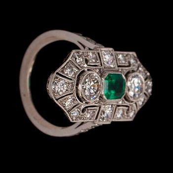 An old cut diamond and step cut emerald ring.