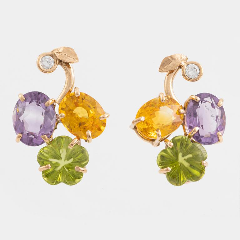 Earrings with yellow sapphires, cut flower-shaped peridot, amethyst, and brilliant-cut diamonds.