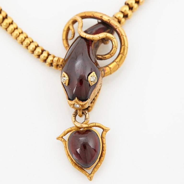 A 14K gold necklace set with garnets and rose-cut diamonds.