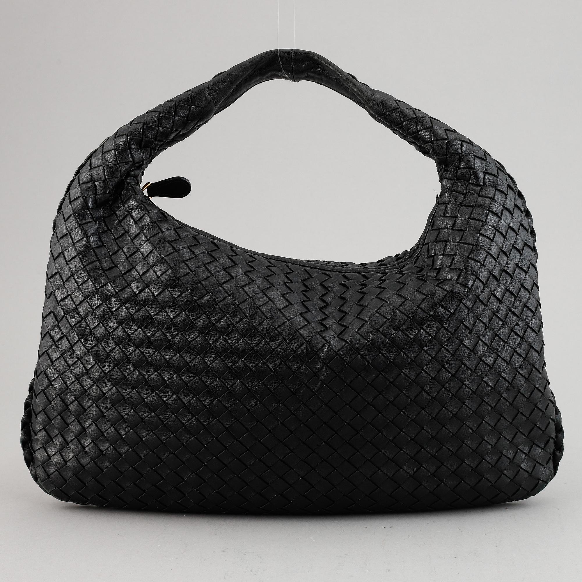 Bottega Veneta, a black leather bag.