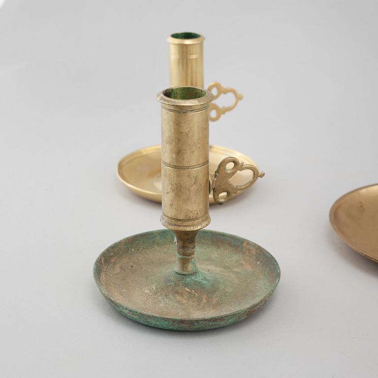 Nine brass candlesticks, 20th century.