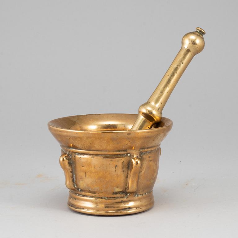 A 17th century bronze mortar and pestle.