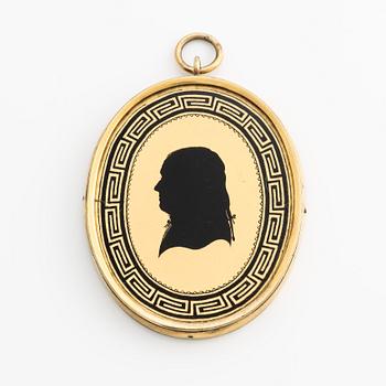 Pendant/memorial medallion with silhouette.