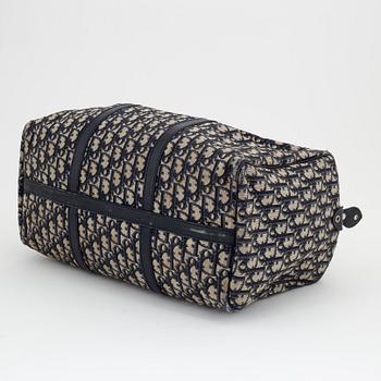 Christian Dior, a canvas handbag, toilet bag and key holder.