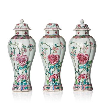 1057. A set of three famille rose vases with covers, Qing dynasty, Qianlong (1736-95).