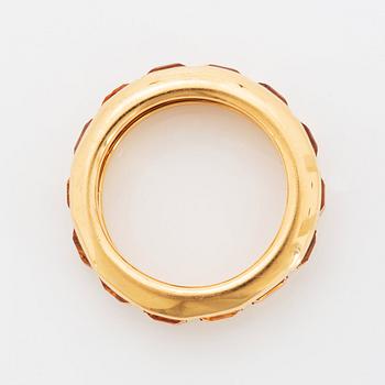 An 18K gold ring set with step-cut citrines.