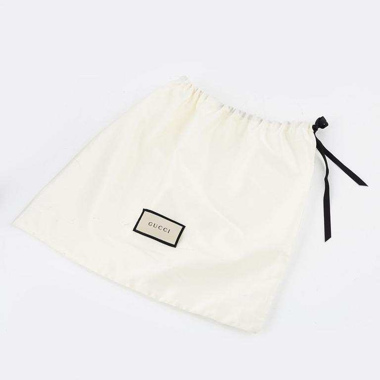 Gucci, a belt bag.