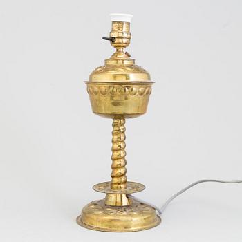 A brass baroque-style table lamp, first half of 20 th century.