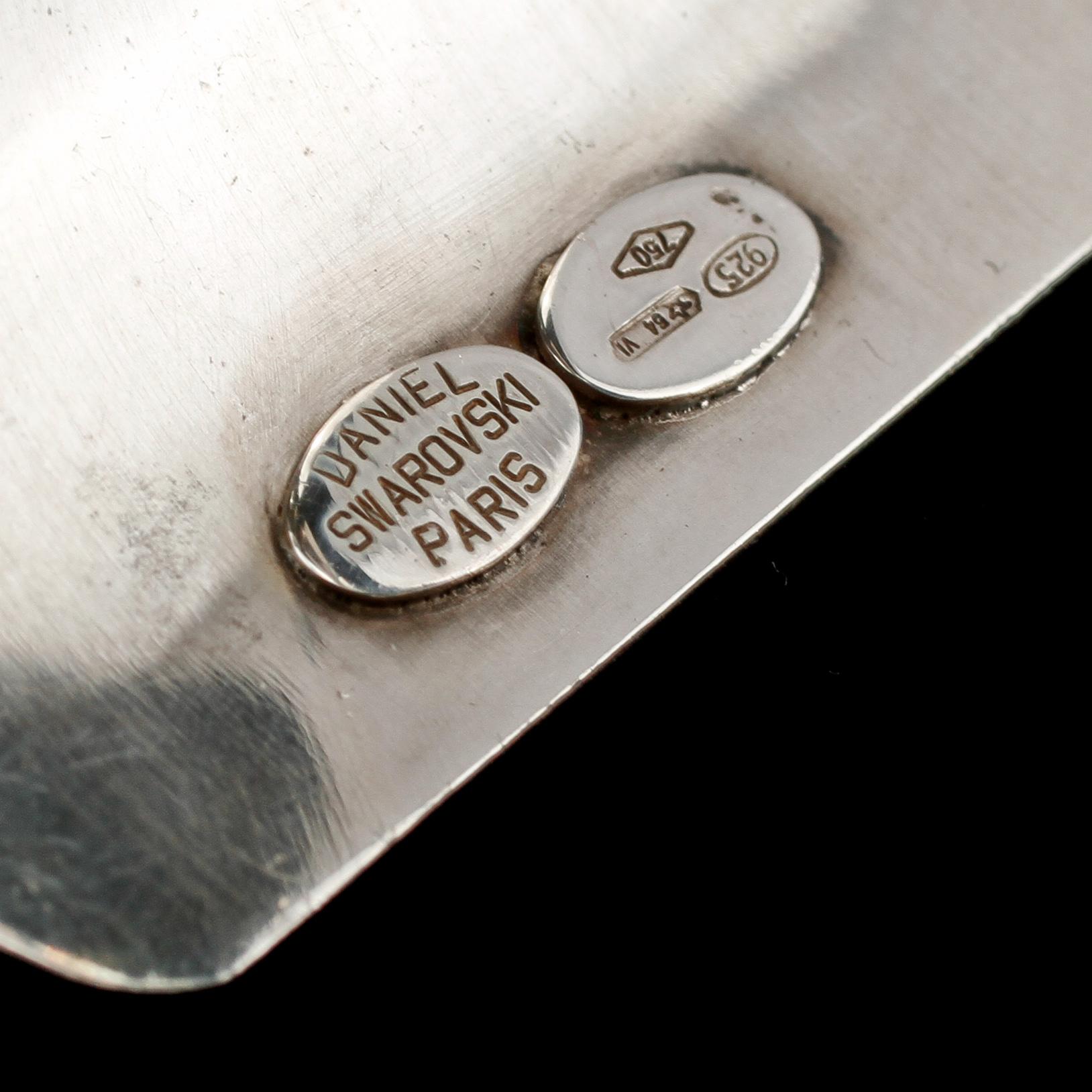 ARMLÄNK, 18k guld och sterlingsilver samt fasettslipad grön sten, Daniel Swarovski, Paris, 1900-tal. Vikt 89 g.