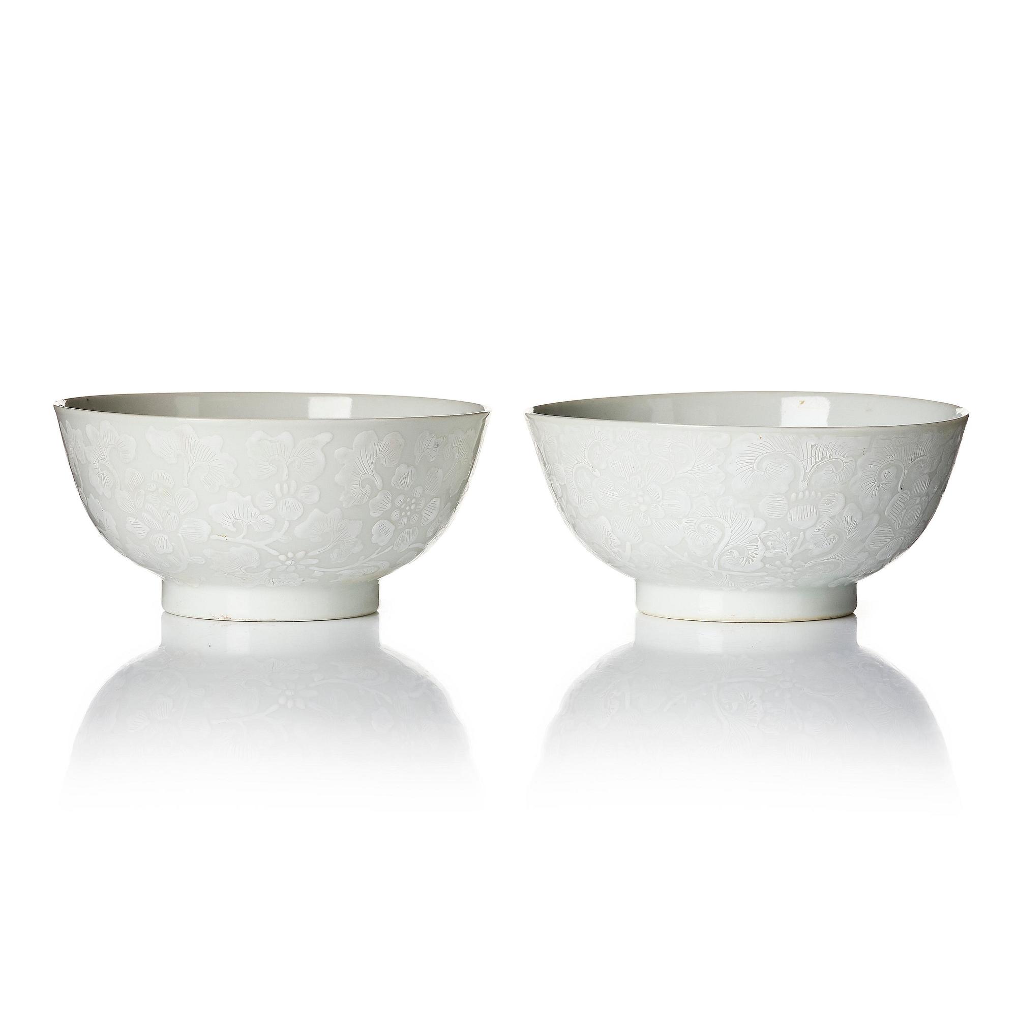A pair of white glazed lotus bowls, Qing dynasty, 18th century.