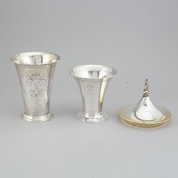 Two silver and parcel-gilt beakers and a parcel-gilt lid, maker's mark K. Andersson, Stockholm, 1927, 1922 and 1948.