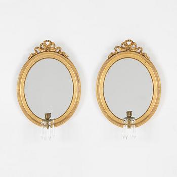 A pair of gilt Gustavian style mirror wall sconces, 20th Century.