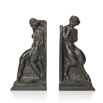 384. Axel Gute, a pair of patinated bronze bookends, early 1900s.