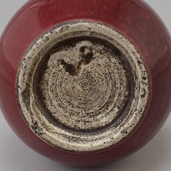 A Chinese copper red glazed bottle vase, presumably late 19th century.