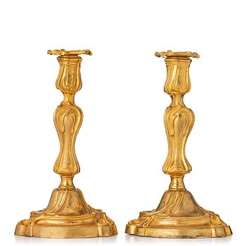 115. A pair of French 18th century gilt-bronz candlesticks, marked. Louis XV.