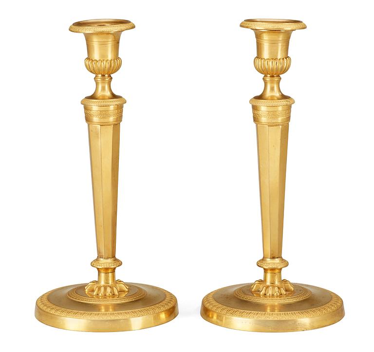 A pair of French Empire early 19th Century candlesticks.