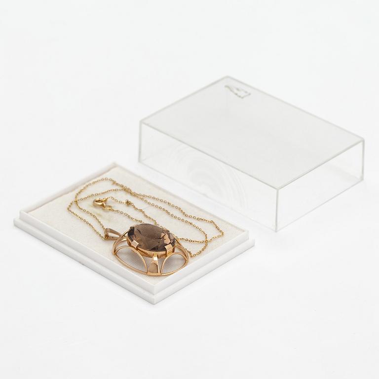 Kaulakoru, 14K kultaa ja savukvartsi. Auran Kultaseppä, Turku.