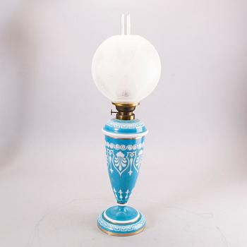 A glass paraffin lamp around 1900.