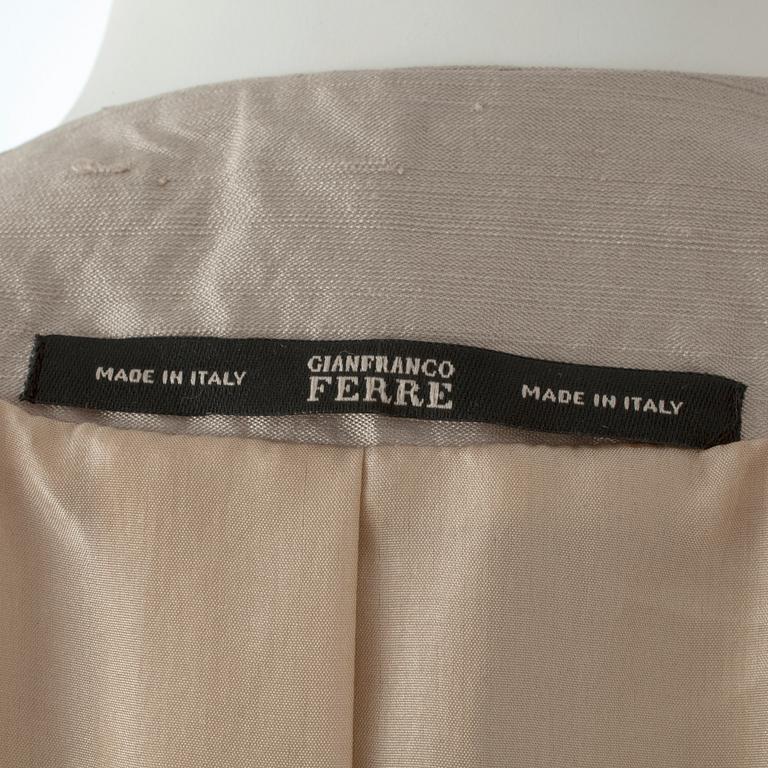 GIANFRANCO FERRÉ, a beige three-piece ensemble consisting of vest , trousers and skirt.