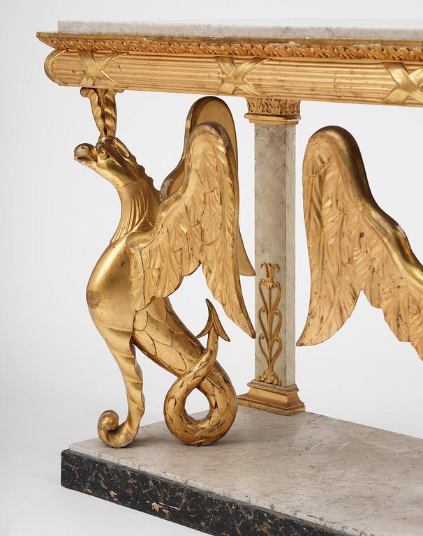 A Swedish Empire gilt wood and white marbel console table.